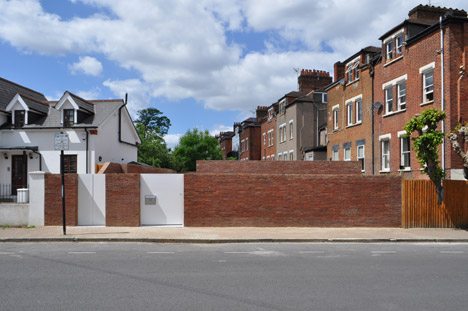 Jack Woolley’s Spiral House Is Hidden Behind A Simple Brick Wall