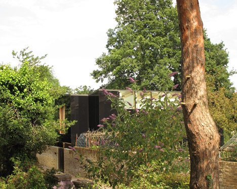 Black Glass Facade Mirrors Scenery At South London Home By Ian McChesney