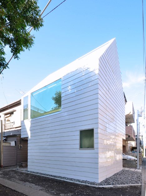 Gabled Townhouse In Tokyo By Niji Architects Is Clad In Strips Of White Steel