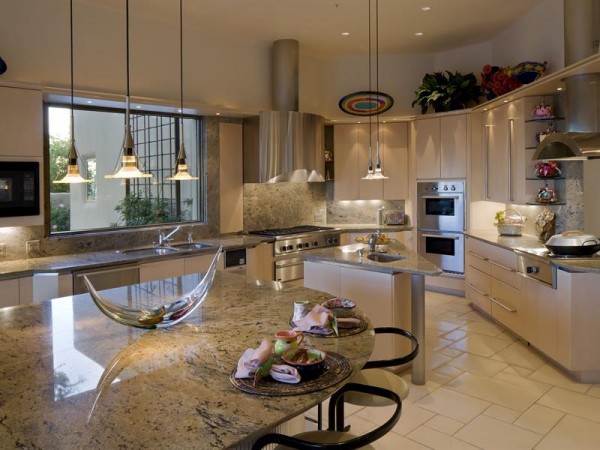 Granite countertops and stainless steel fixtures in the expansive kitchen are timeless, though.
