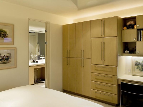 Custom cabinetry in the master bedroom offer plenty of storage.