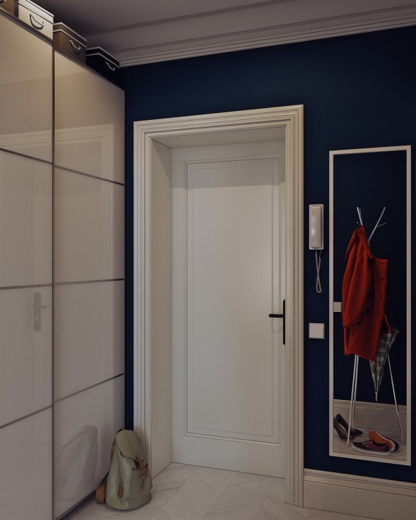 The designers pull dark blue into the entryway with these stunning walls.