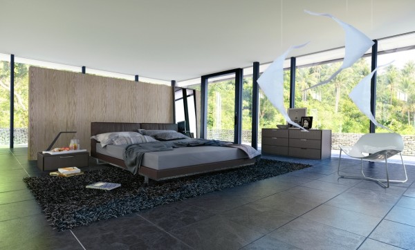 A wall behind the bed offers the tiniest bit of privacy in this otherwise glass-encased bedroom.
